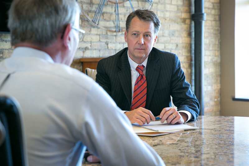 Attorney Greg Hildebrand meeting with a client.